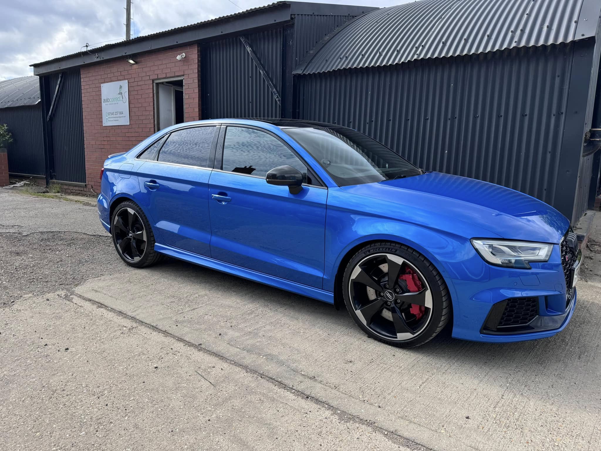 Blue Audi saloon outside the Autocorrect workshop