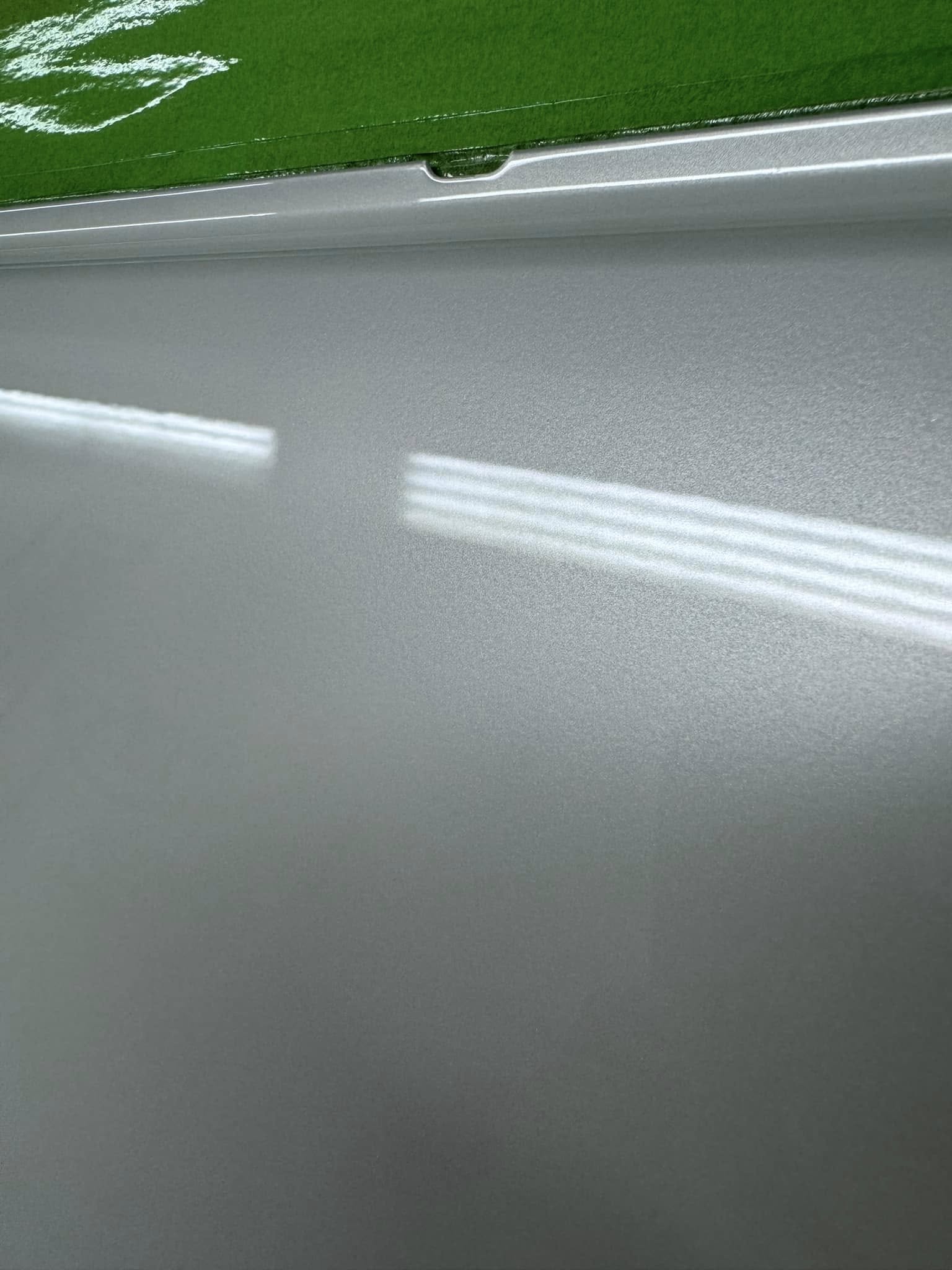 Close-up of freshly finished pearl white paintwork