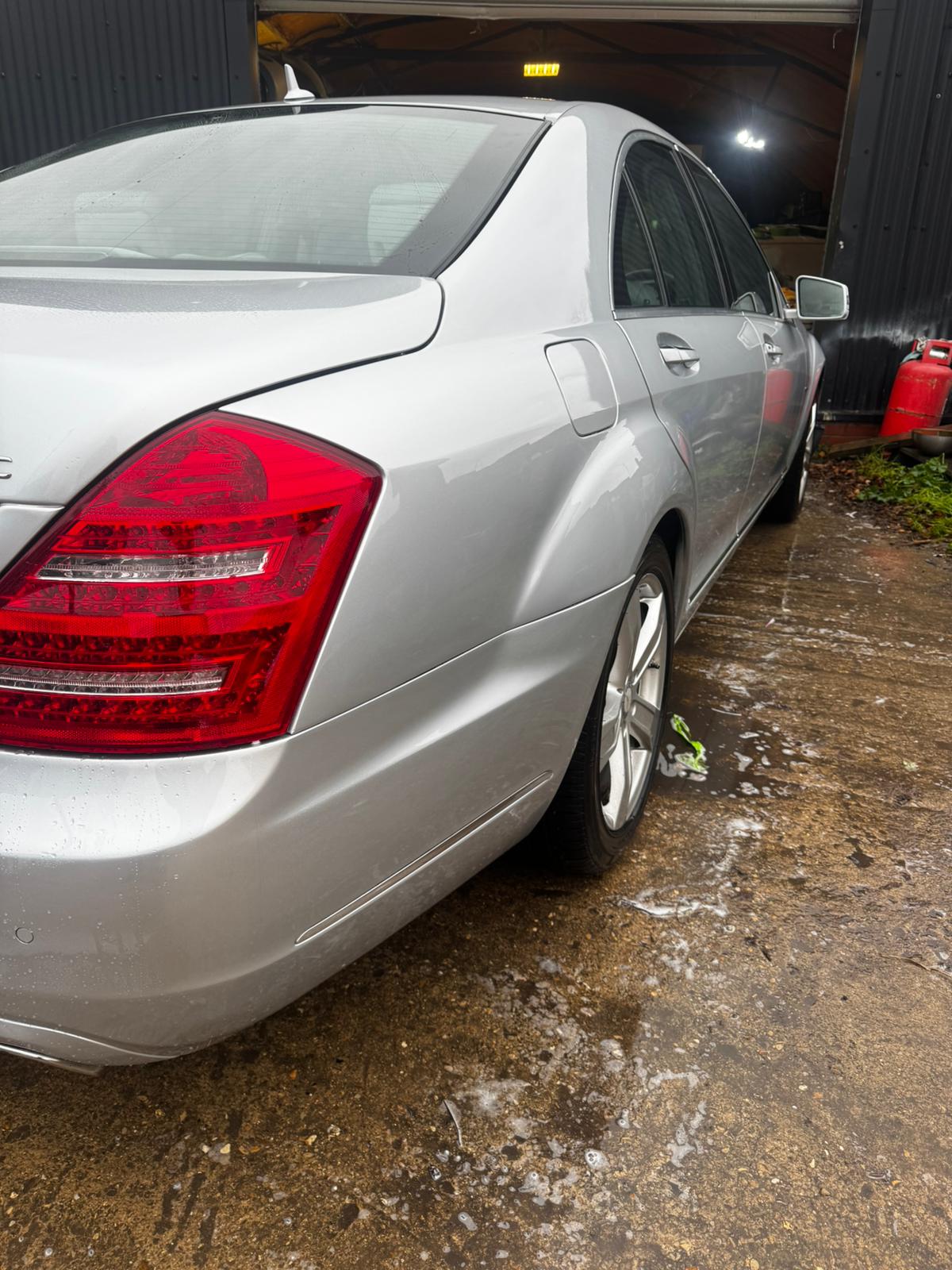 The same silver Mercedes with its rear quarter repaired